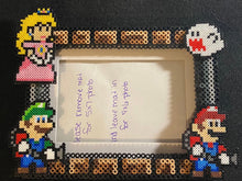 Load image into Gallery viewer, Ghost Hunting Luigi, Mario, Peach Perler Inspired Fanart- Perler Glass Picture Frame - Fits 4x6 or 5x7 Photos- Choose Horizontal or Vertical

